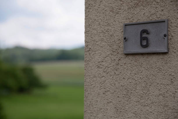 House number six with green landscape