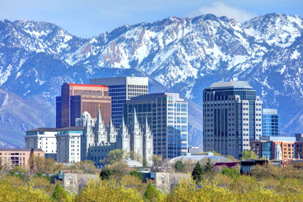Salt Lake City Skyline and the Wasatch Mountains Salt Lake City is the capital and the most populous municipality of the U.S. state of Utah salt lake city mormon temple utah photos stock pictures, royalty-free photos & images