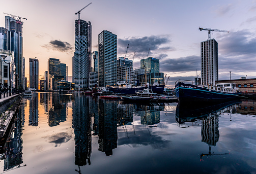 London / UK - Sep 5th 2019: View of Canary Wharf, financial hub in London at sunset with construction
