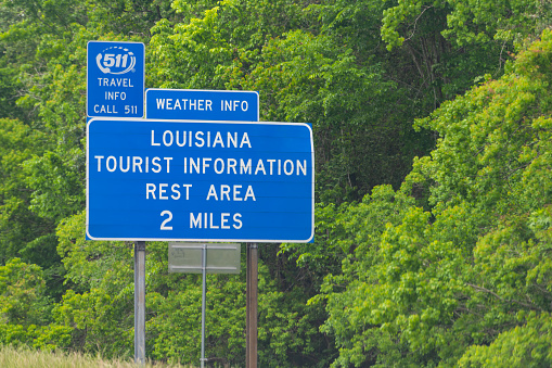Slidell, USA - April 22, 2018: Highway road with closeup of welcome to Louisiana sign and text on interstate i10