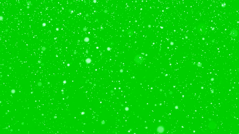 Isolated falling snow on green chroma key background