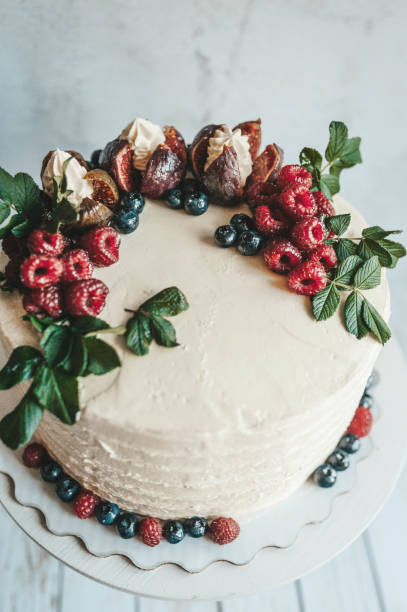 istock Cake decorated with fruits and berries 1175108510