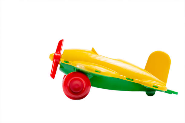 istock yellow toy airplane with propeller and landing gear isolate on a white background without shadow. The concept of travel and flight. 1175111772