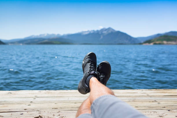 istock Man relaxing by the lake 1175112142