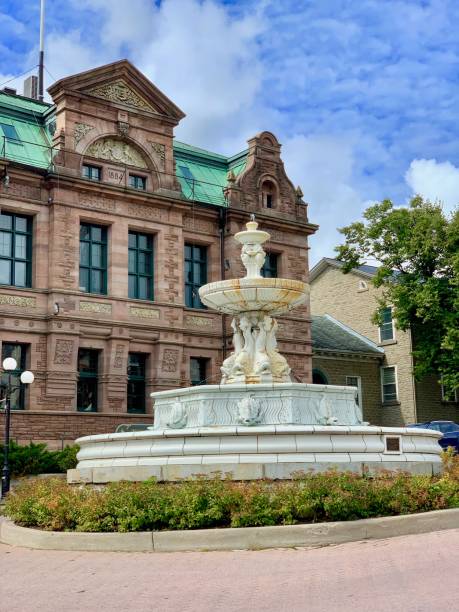 Brockville, Ontario, Canada - September 7, 2019: Some architectural elements on Court House Avenue include the John H. Fulford Fountain built in 1917 boasts Italian Renaissance features and the historic Thomas Fuller Building which serves as a Service Canada location today.