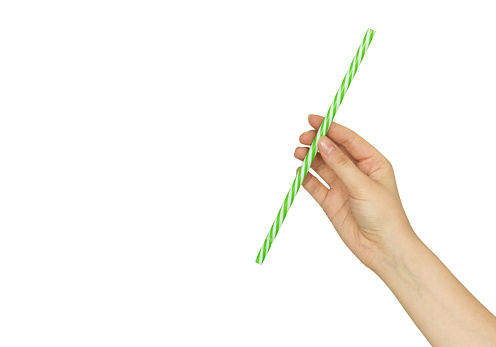 hand holding drinking straw isolated on white background.
