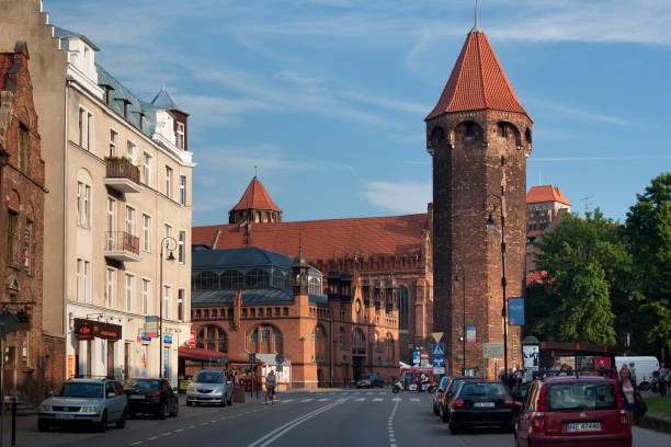 View of the St. Hyacinth Tower. Is the highest (36 m) municipal tower in Gdansk. Built around 1400, in the north-western corner of the defensive walls of the Main Town. GDANSK, POLAND - JUNE 07, 2014: View of the St. Hyacinth Tower. Is the highest (36 m) municipal tower in Gdansk. Built around 1400, in the north-western corner of the defensive walls of the Main Town. hyacinth red stock pictures, royalty-free photos & images
