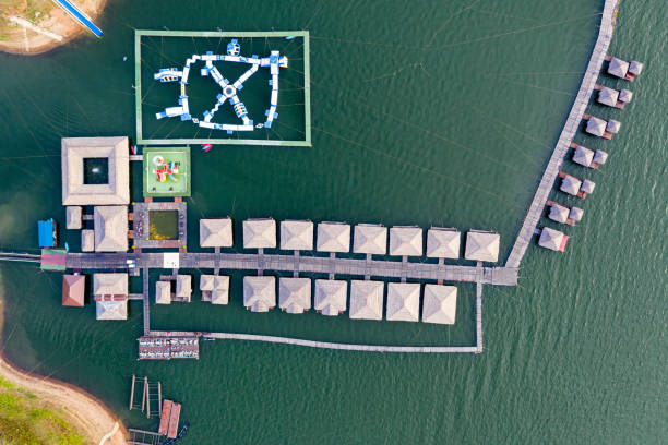 istock Wooden raft resort with water park floating on dam 1175127915