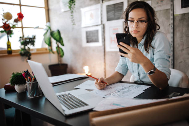 istock Multitasking of young female entrepreneur at work 1175128235