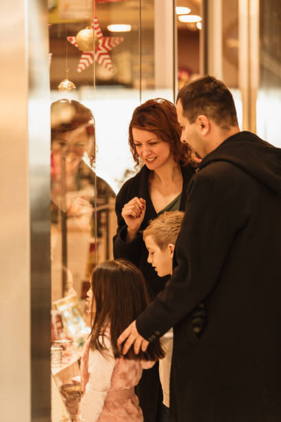 istock Family window shopping at the mall 1175129941