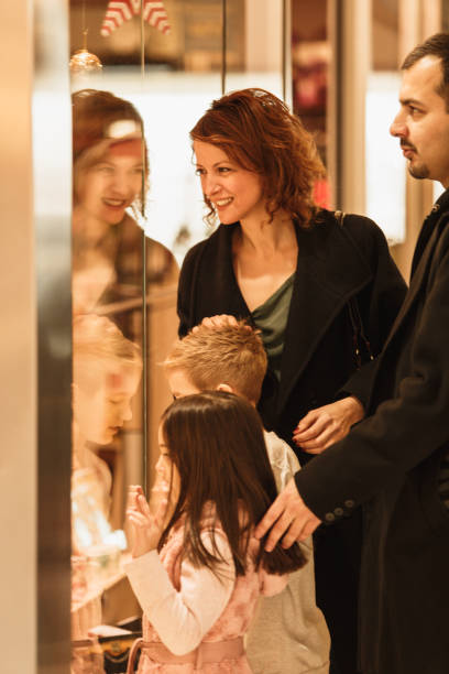 istock Family window shopping at the mall 1175129946