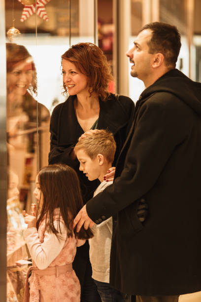 istock Family window shopping at the mall 1175129951