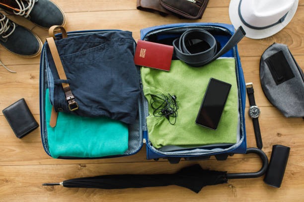 istock Clothes and personal possessions packed in suitcase 1175130000