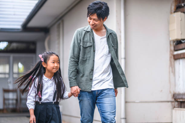 istock Japanese Father Walking Elementary Age Daughter to School 1175130026