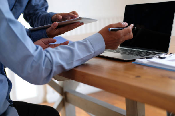 istock business people have a meeting. businessman working with team using tablet 1175131267