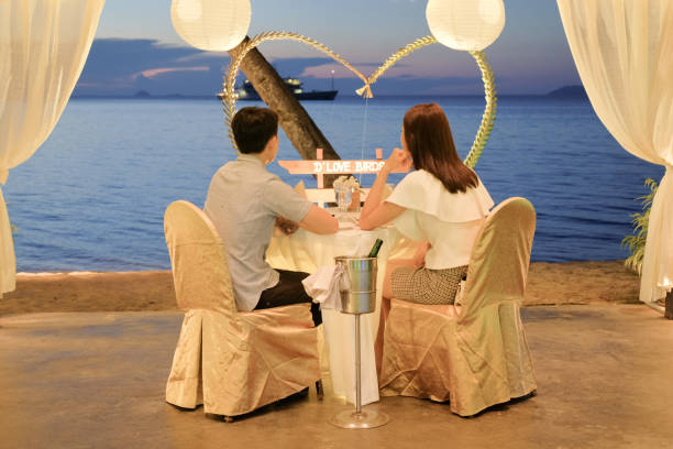 istock Young couple enjoying a romantic dinner by candlelight, outdoor 1175133488