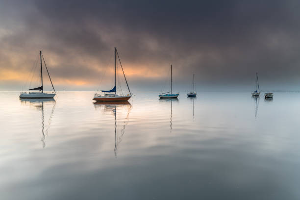 istock Misty Morning Waterscape with Boats 1175136207