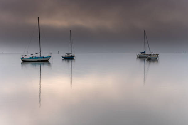 istock Misty Morning Waterscape with Boats 1175136246
