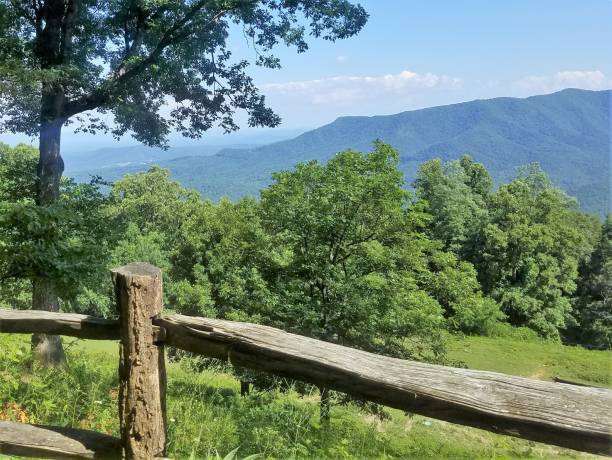istock A split-rail fence frames a panorama of rolling mountains. 1175140035