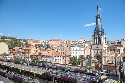 Picture of the departures platforms of Lyon Saint Paul train station with the Church Saint Paul de Lyon in background. The eglise Saint-Paul is a Roman Catholic church located in Lyon, France. It is situated in the Vieux Lyon, in the Saint-Paul quarter, in the 5th arrondissement of Lyon.