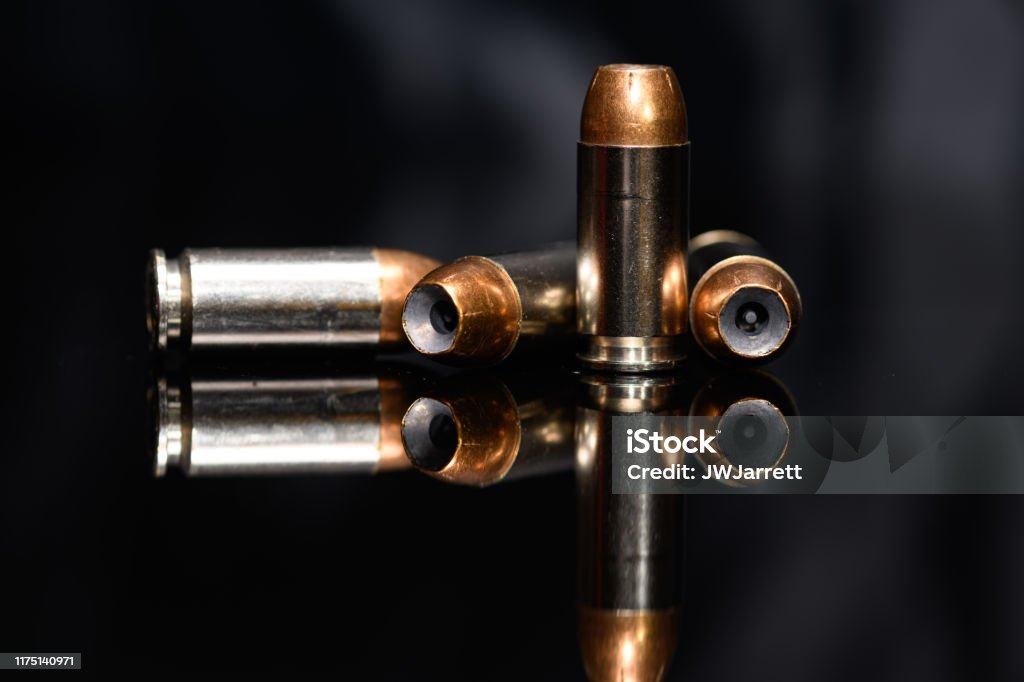 40 Caliber hollow point ammunition on black background National Rifle Association Stock Photo