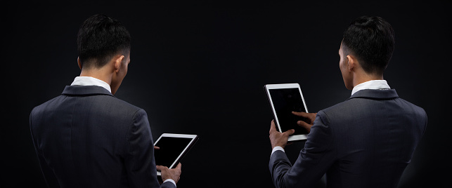 Group Pack Collage of Portrait 20s Asian Business Man under studio lighting dark background, Male in Proper Gray Suit hold digital tablet in hand and check social media, read e-mail report, iot