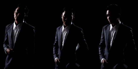 Group Pack Collage of Portrait 20s Asian Business Man under studio lighting low exposure backlit silhouette dark background, Male in Proper Gray Suit pose many action in Shadow