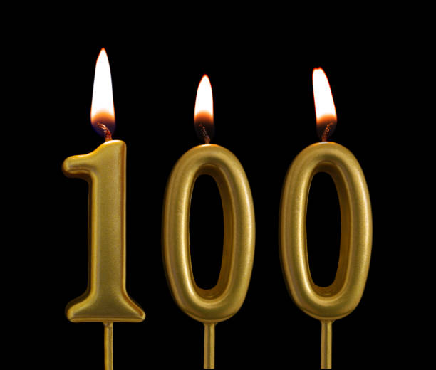istock Golden birthday candles on black background, number 100 1175146806