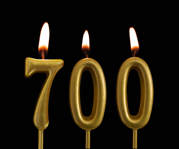 istock Golden birthday candles on black background, number 700 1175146816