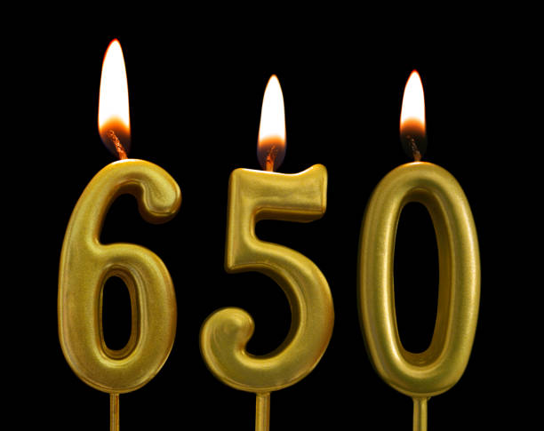 istock Golden birthday candles on black background, number 650 1175146896