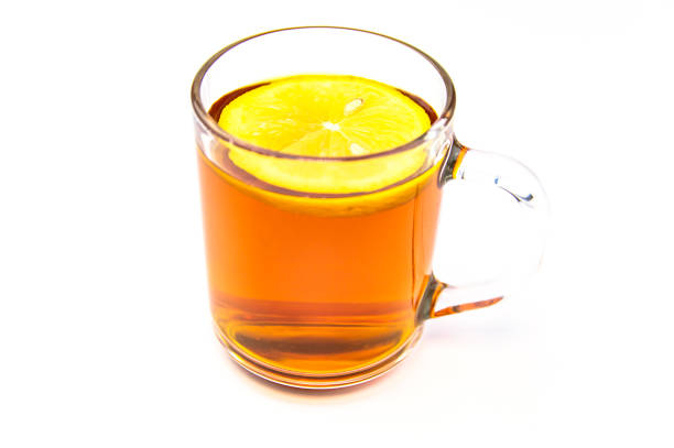 istock Glass cup of tea with lemon on a white background. 1175147581