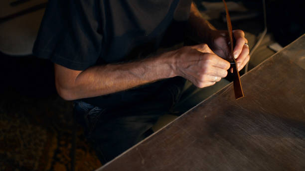 istock Craftsman holding crafting tool and working. 1175148446