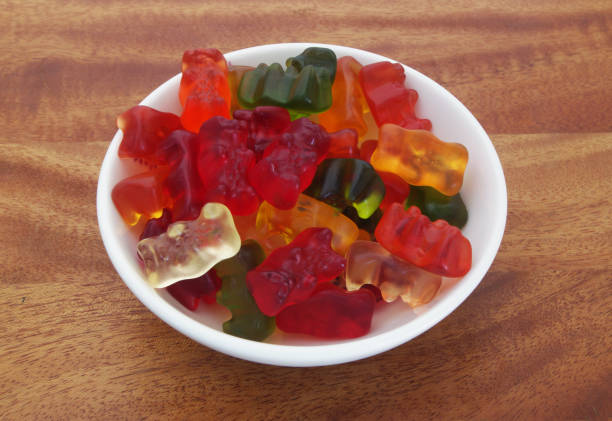 istock Gummy bears candies on wooden background 1175148531