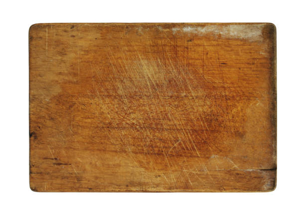 istock Old wooden cutting board isolated on white 1175149318