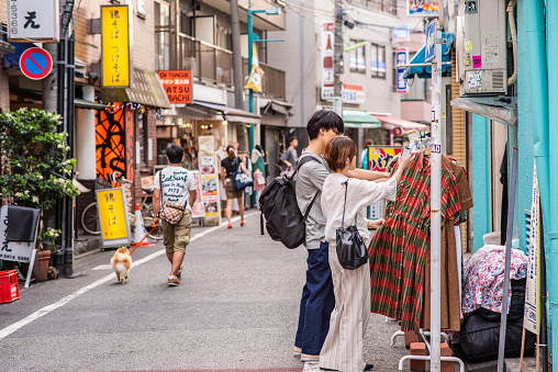Tokyo, Japan - June 1, 2019: A stylish couple goes vintage shopping in Shimokitazawa, a cool Setagaya neighborhood known for great shopping and nightlife. More than 800,000 live in Setagaya.