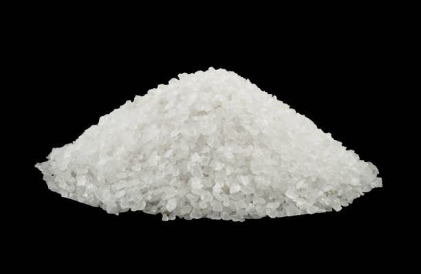 istock Sea salt heap isolated on black background 1175150158