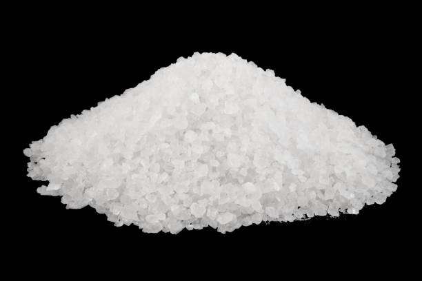 istock Sea salt heap isolated on black background 1175150525