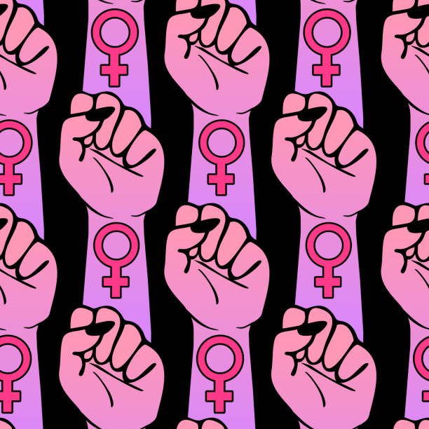 istock Seamless pattern with womens' raised clenched fists with venus symbols isolated on black background. Gender equality, feminist vector wallpaper. 1175151150