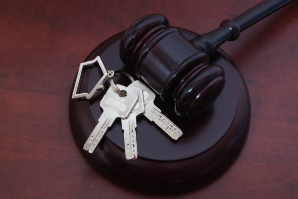istock Judge gavel and keys with key holder 1175151557
