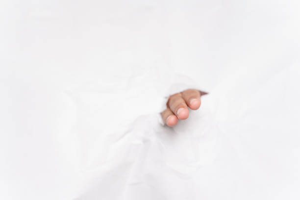 istock Use a hand to punch through the paper. 1175151599