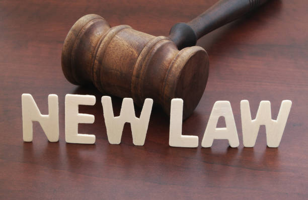 Judge gavel and words NEW LAW close up stock photo