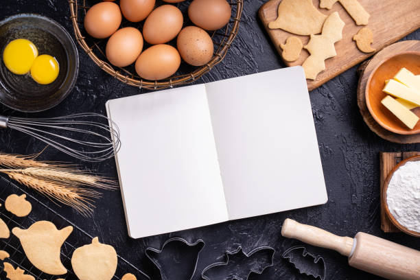 istock Making cookies cookbook recipe design concept, baking ingredients preparation layout with notebook. 1175153523