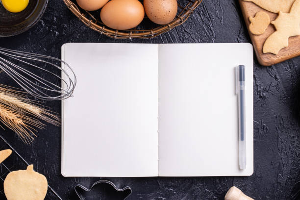 istock Making cookies cookbook recipe design concept, baking ingredients preparation layout with notebook. 1175153525
