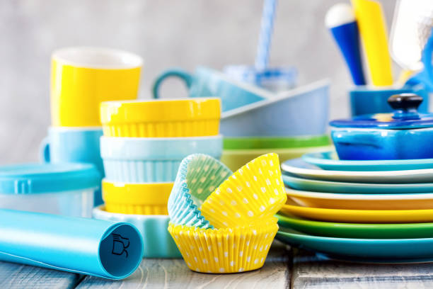 istock Colorful dishes and utensils. Ceramic kitchenware on a wooden background. Selective focus 1175154668