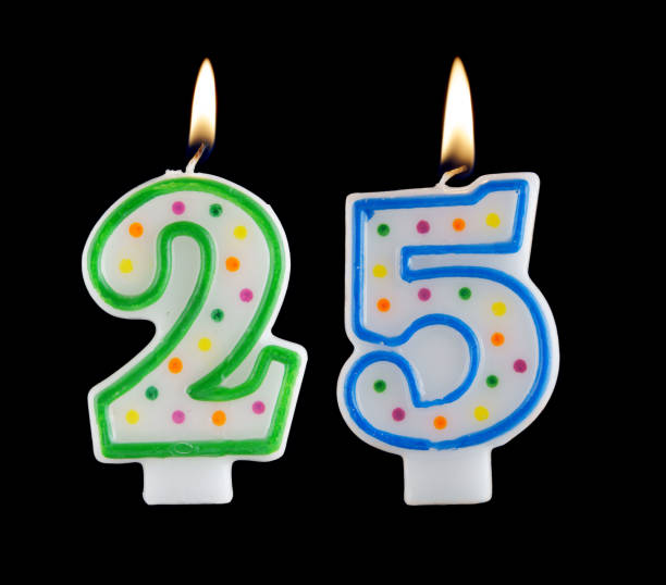 istock Birthday candles on black background, number 25 1175154844