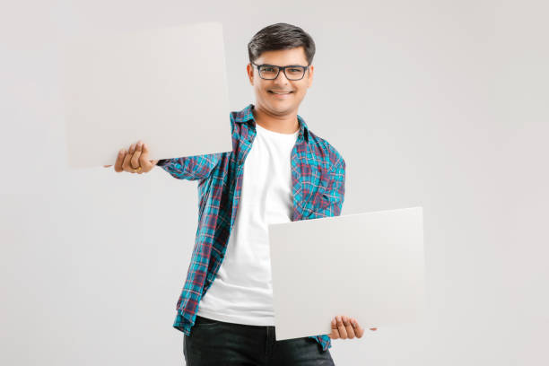 istock Indian/Asian Young Man showing blank signboard on White background 1175161484