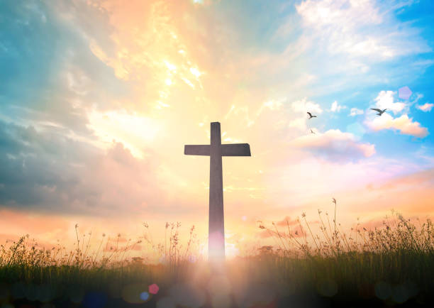 The cross at autumn background Resurrection of Jesus Christ concept: Silhouette cross on beach autumn sunrise background resurrection sunday stock pictures, royalty-free photos & images