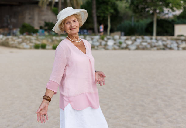 istock Senior woman relaxing at seaside 1175163456