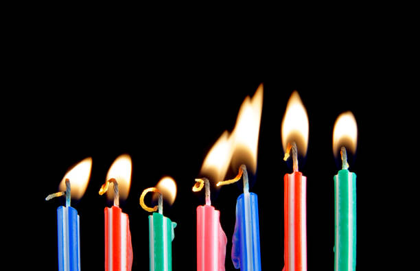 istock Colorful birthday candles on black background 1175163509