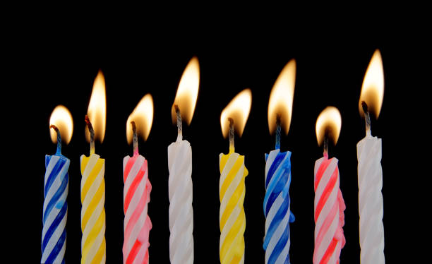 istock Colorful birthday candles on black background 1175163571